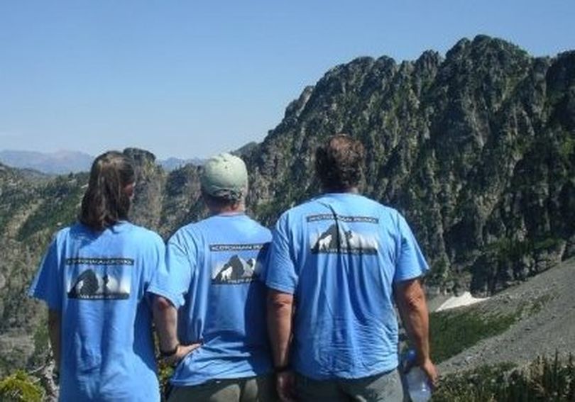 Deb Hunsicker, left, and Phil Hough, center, pose with a friend on Goat Mountain in the proposed Scotchman Peaks Wilderness wearing the shirts for the advocacy group, Friends of the Scotchman Peaks Wilderness based in Sandpoint. (Courtesy)