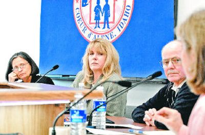 Coeur d'Alene School Board members, from left, Edie Brooks, Christie Wood and Sid Frederickson listen to Assistant Superintendent Hazel Bauman, right, talk about cuts that will be made if   a levy doesn't pass. 
 (Jesse Tinsley / The Spokesman-Review)