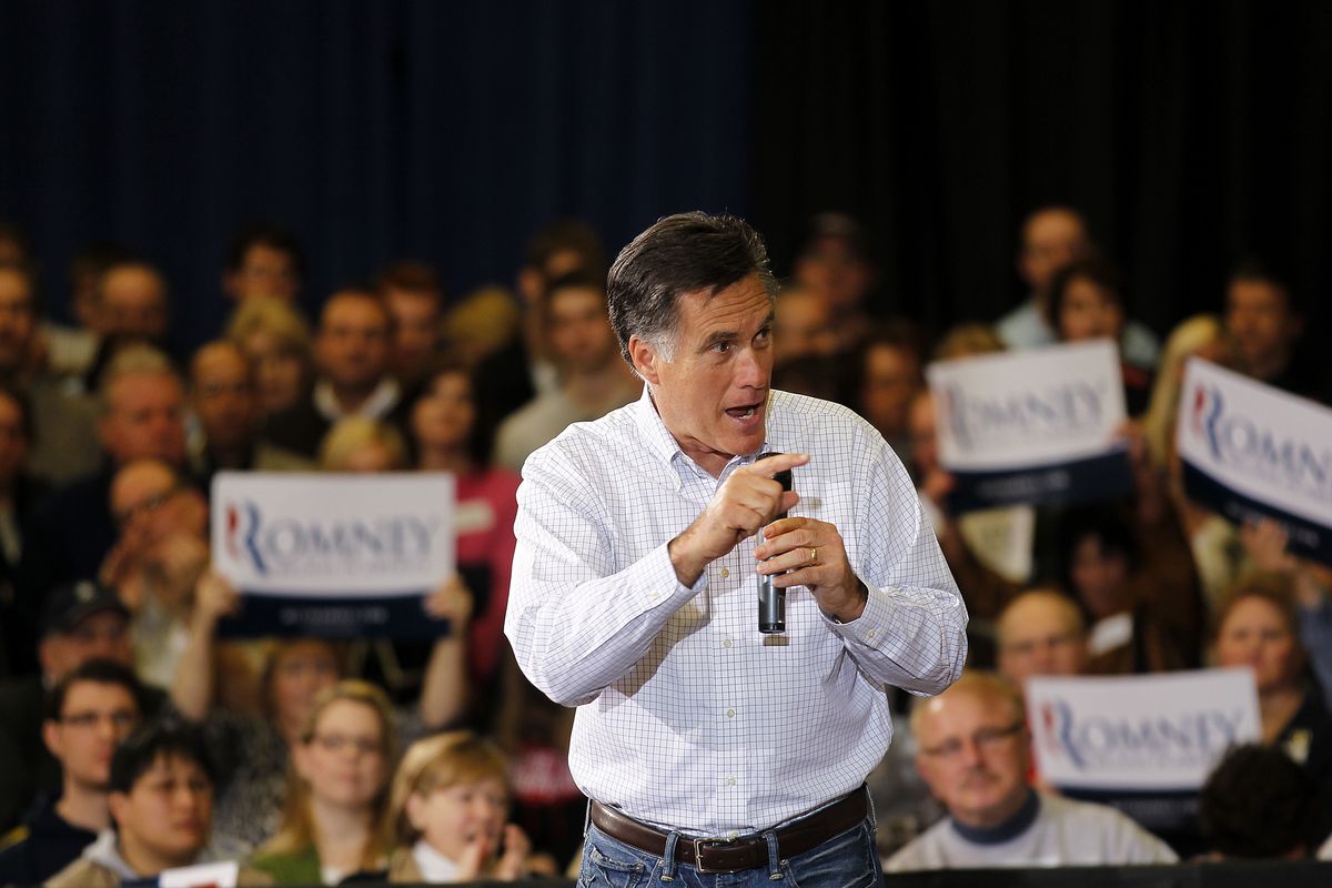 Mitt Romney addresses the crowd at a campaign rally Saturday in Flint, Mich.