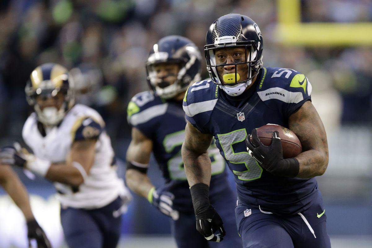 Linebacker Bruce Irvin rambles to the end zone after making an interception. (Associated Press)