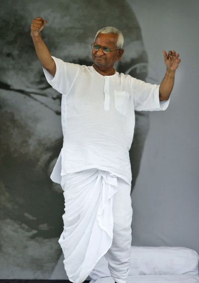 India’s anti-corruption activist Anna Hazare greets his supporters during the twelfth and final day of his hunger strike in New Delhi, India, on Saturday. (Associated Press)