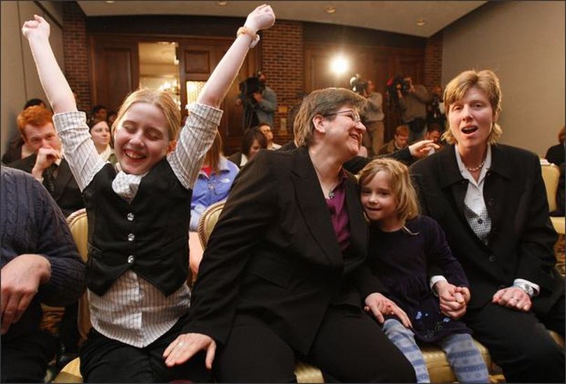 Dawn BarbouRoske, second from left, of Iowa City, leans towards her partner, Jen BarbouRoske after learning of the Iowa Supreme Court ruling in favor of legalizing gay marriage in Des Moines, Iowa on Friday. Between them is their daughter Bre, 6. Their other daughter, McKinley, 11, reacts to the ruling at left. (AP Photo/The Des Moines Register, Christopher Gannon) (April 03, 2009) (The Spokesman-Review)