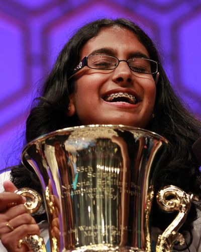 Snigdha Nandipati holds her trophy after she won the National Spelling Bee on Thursday. (Associated Press)