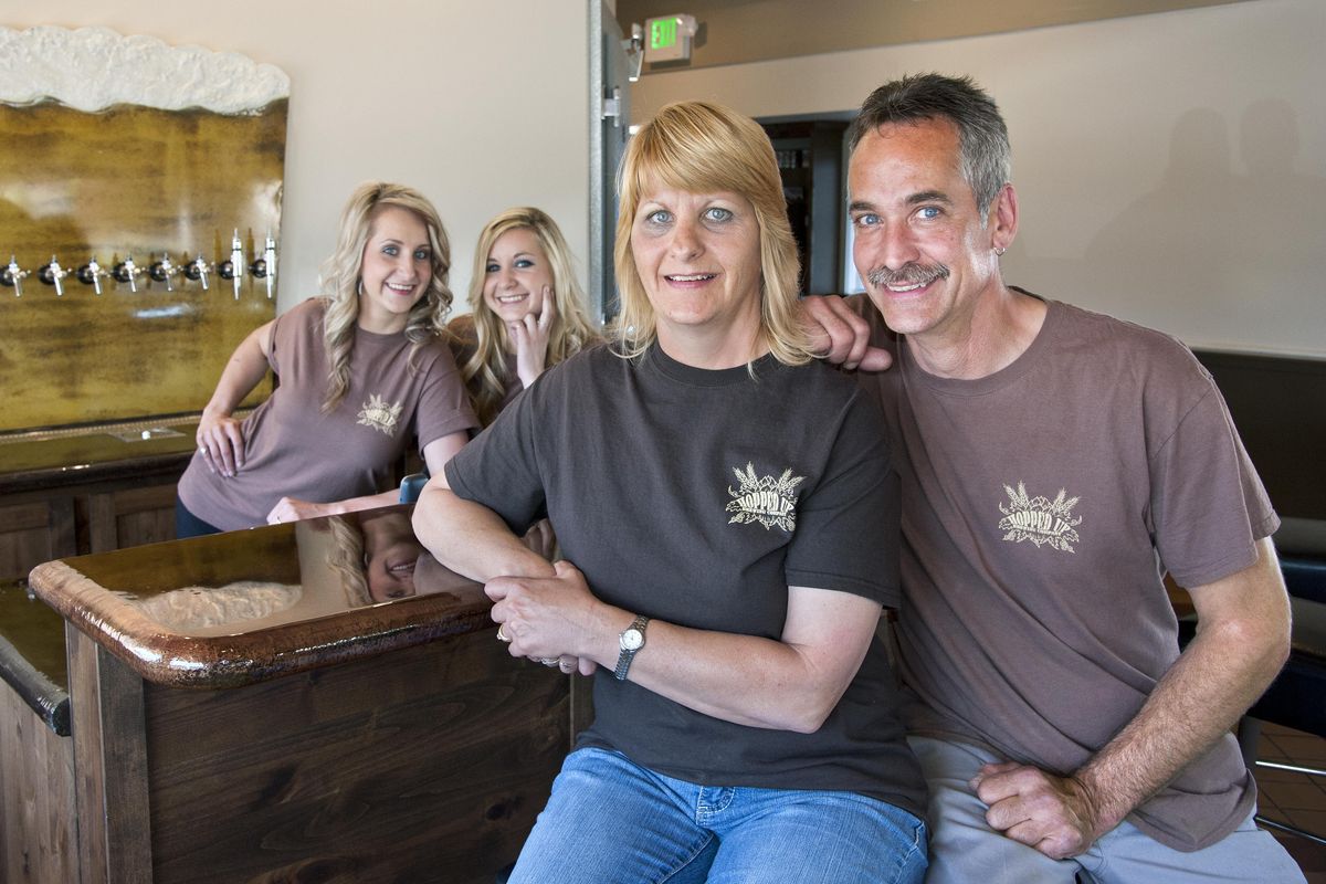 Sue and Steve Ewan, along with their daughters, Amanda Sue, left, and Annette have opened Hopped Up in the former IHOP building at 10421 E. Sprague Avenue in Spokane Valley, Wash. (Dan Pelle / The Spokesman-Review)