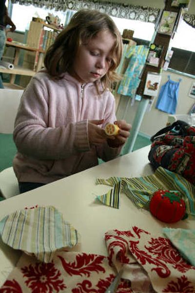 
The Spokesman-Review Leslee Wilson, 8, prepares to sew a fabric flower at The Top Stitch in north Spokane.
 (Megan Cooley / The Spokesman-Review)