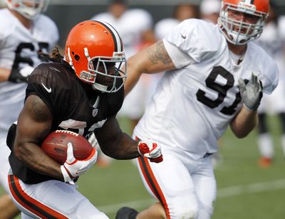 Browns running back Trent Richardson, the No. 3 pick in April’s draft, is having his ailing left knee examined by a specialist. (Associated Press)