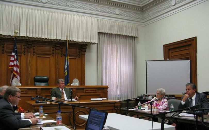 The Idaho State Land Board meets Tuesday; state schools Supt. Tom Luna, right, cast the lone vote against keeping endowment distributions to public schools even next year. Attorney General Lawrence Wasden, left, made the motion; Gov. Butch Otter is presiding. (Betsy Russell)
