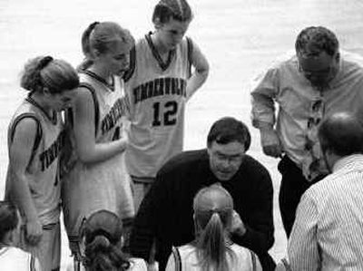 David Fealko, center, shown coaching Lake City's girls, guided the Timberwolves to a state championship after winning four at Coeur d'Alene High. 
 (File/ / The Spokesman-Review)
