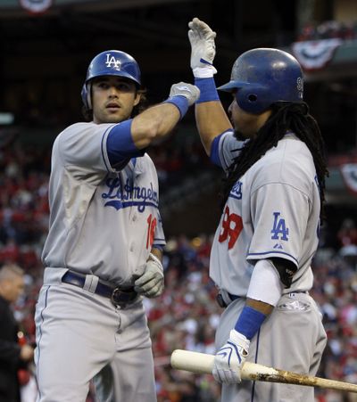 Andre Ethier, left, has added punch to a Los Angeles Dodgers lineup that includes potent Manny Ramirez, right.  (Associated Press / The Spokesman-Review)