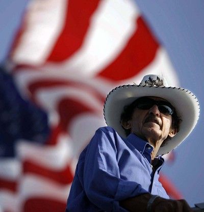 NASCAR great Richard Petty watches a  practice session for the Pennsylvania 500 auto race from the top of his teams hauler at Pocono Raceway in Long Pond, Pa.,  Saturday, Aug. 4, 2007.  (AP Photo/Carolyn Kaster)  ORG XMIT: PACK108 (Carolyn Kaster / The Spokesman-Review)