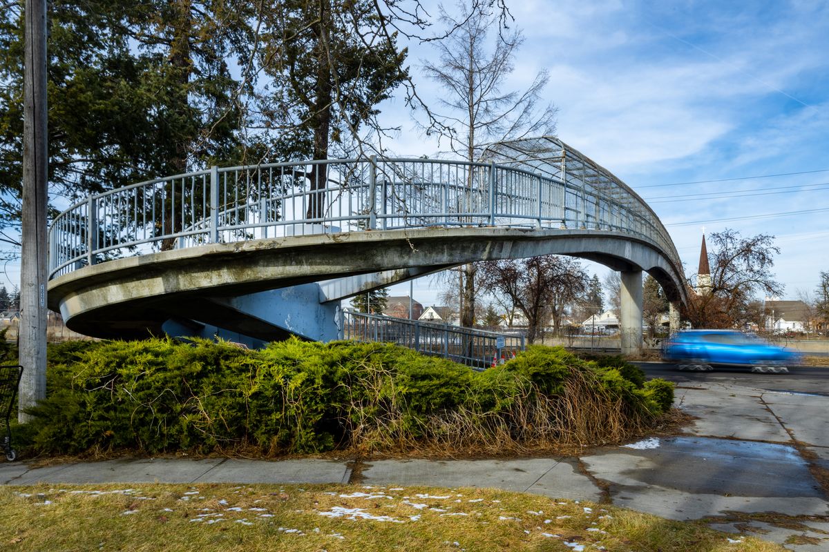After an inspection determined the Magnolia Street pedestrian bridge spanning I-90 was rated beyond repair by the Washington Department of Transportation, the structure near Liberty Park was permanently closed on Wednesday.  (COLIN MULVANY/THE SPOKESMAN-REVIEW)