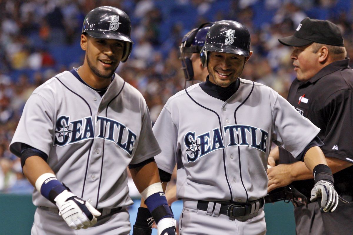 Seattle’s Franklin Gutierrez, left, hit a two-run home run in first inning with Ichiro Suzuki on base. It was the first of three homers for the M’s.   (Associated Press)