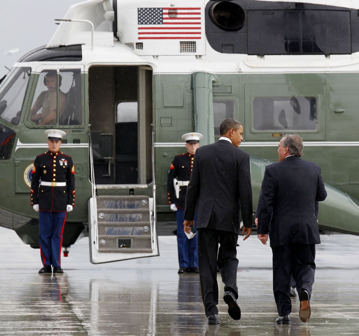President Barack Obama walks with Chicago Mayor Richard M. Daley to the Marine One helicopter at O’Hare International Airport in Chicago on Wednesday.  (Associated Press)