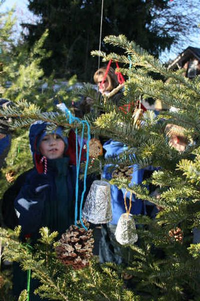 
Students from Spirit Lake Elementary School placed ornaments on the trees during the annual decorating party.
 (Photo by Mary Jane Honegger / The Spokesman-Review)
