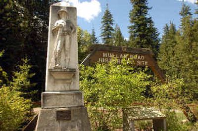 
A stone marker and sign sit at the Fourth of July pass east of Coeur d'Alene, one of the historic sites associated with Capt. John Mullan who oversaw the building of a road from Missoula to Walla Walla in 1862. 
 (Jesse Tinsley / The Spokesman-Review)