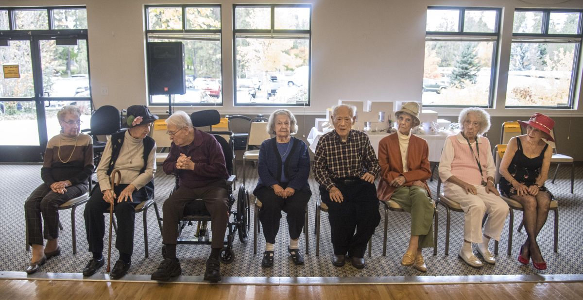 Centenarians, from left, Martha Lou Butler, Marie Pilgrim, Ray Garrett, Ruth Smith, Han Chung Meng, Ann Smith Babcock, Lucile Durkee and Catherine Child, gather before a luncheon to honor them, Tuesday, Oct. 17, 2017, at the Southside Senior and Community Center. (Dan Pelle / The Spokesman-Review)