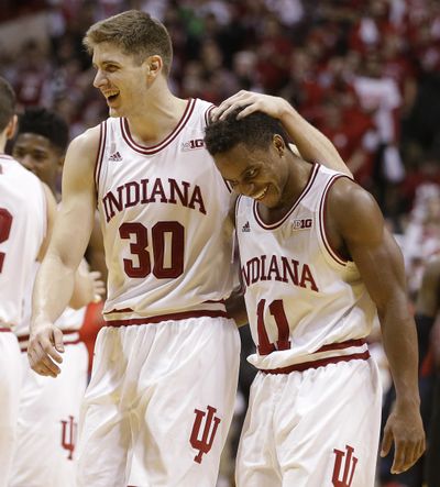 Indiana's Collin Hartman, left, and Yogi Ferrell, right, celebrate. (Darron Cummings / Associated Press)