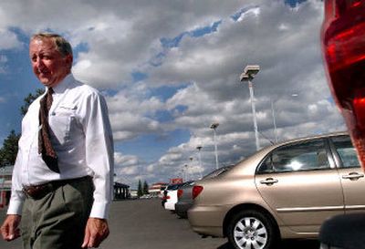 
Sales associate Dave Liggett walks out to the used car section on the lot of Parker Toyota last week. Because of high gas prices, the used car market already has shifted slightly. 
 (Kathy Plonka / The Spokesman-Review)