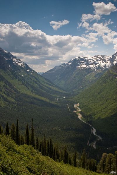 Glacer National Park's Going to the Sun Road offers breathtaking views of snow-capped mountains. Many of America's national parks are threatened by pollution and climate change. (ARAcontent)