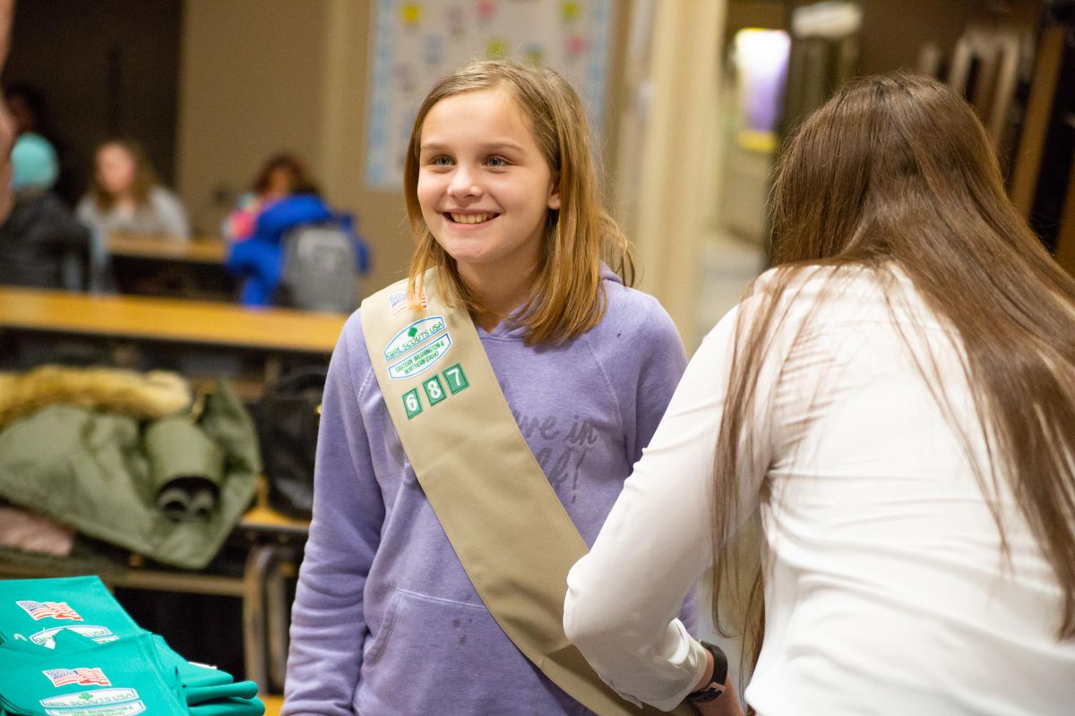 Audubon Elementary School sixth-grader Ellianna Frye receives her Girl Scouts sash during a gathering at the school Thursday, Jan. 24, 2019. This was the first meeting for the brand new troop, which is a part of Girl Scouts of Eastern Washington and Northern Idaho, and consists of fourth-, fifth- and sixth-graders. (Libby Kamrowski / The Spokesman-Review)