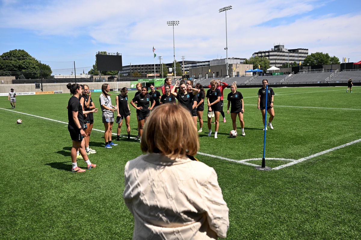 Spokane Mayor Lisa Brown visits with the Spokane Zephyr after a practice on Tuesday, Aug. 13, 2024, at ONE Spokane Stadium in Spokane, Wash. Brown came to the practice to proclaim Spokane Zephyr