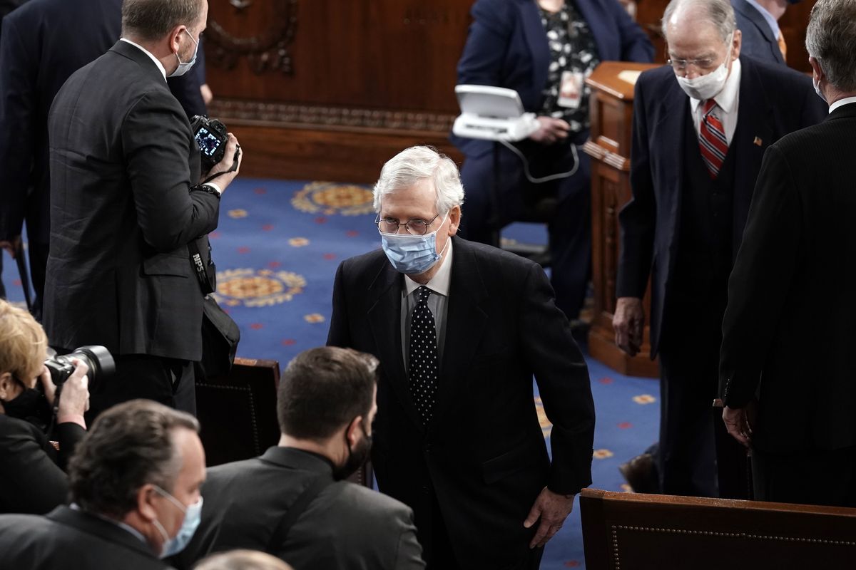 Senate Majority Leader Mitch McConnell, R-Ky., leaves the House chamber for the Senate to consider objections to certify Electoral College votes, at the Capitol in Washington, Wednesday, Jan. 6, 2021.  (J. Scott Applewhite)