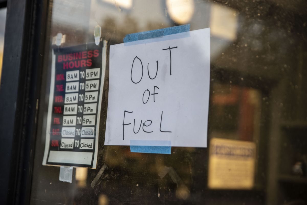 A sign reading "Out of Fuel" is taped to the window at an Exxon Gas Station on Boonsboro Road in Lynchburg, Va., Tuesday, May 11, 2021. More than 1,000 gas stations in the Southeast reported running out of fuel, primarily because of what analysts say is unwarranted panic-buying among drivers, as the shutdown of a major pipeline by hackers entered its fifth day. In response, Virginia Gov. Ralph Northam declared a state of emergency.  (Kendall Warner)