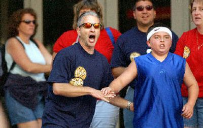 
Coach Bill Moore, left, and Ryan Kouchakji of MORFUNTOO react to a basket. 
 (Joe Barrentine / The Spokesman-Review)