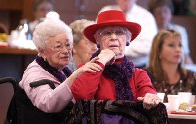 
Roma Gemmel, left, and her friend Wini Jent enjoy the Holiday Koffee Klatsch Style Show on Thursday at CenterPlace at Mirabeau Point in Spokane Valley. It was the first visit to the community center for both of them and 