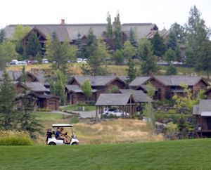 Golfers enjoy the members-only golf course at the Club at Black Rock, the gated golf community in the Rockford Bay area south of Coeur d'Alene Thursday, Aug. 12, 2010. On that day, Washington Trust Bank foreclosed on the areas owned by developer Marshall Chesrown. (Jessie Tinsley/SR)