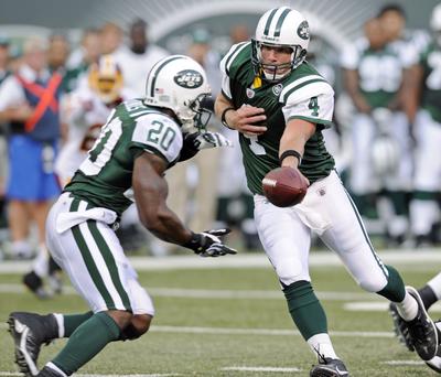 Jets QB Brett Favre, right, played 14 plays in a loss to Washington.  (Associated Press / The Spokesman-Review)