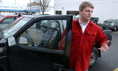 Jim Wierson, of Clackamas, Ore., talks about the idea of a mileage tax as he stands next to his pickup in Portland on Wednesday. Facing the possibility of lower tax revenue from gasoline sales, the state is considering a tax on the number of miles driven.  (Associated Press / The Spokesman-Review)