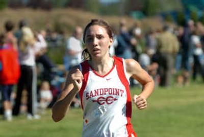 
Megan Bartlett crosses the finish line at the Coaster Cross last Saturday, improving her time by 35 seconds from a year ago and giving her high hopes this season. 
 (Jesse Tinsley / The Spokesman-Review)