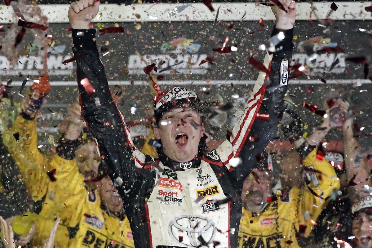 Erik Jones celebrates in Victory Lane after winning the NASCAR Cup Series auto race at Daytona International Speedway, Saturday, July 7, 2018, in Daytona Beach, Fla. (John Raoux / Associated Press)
