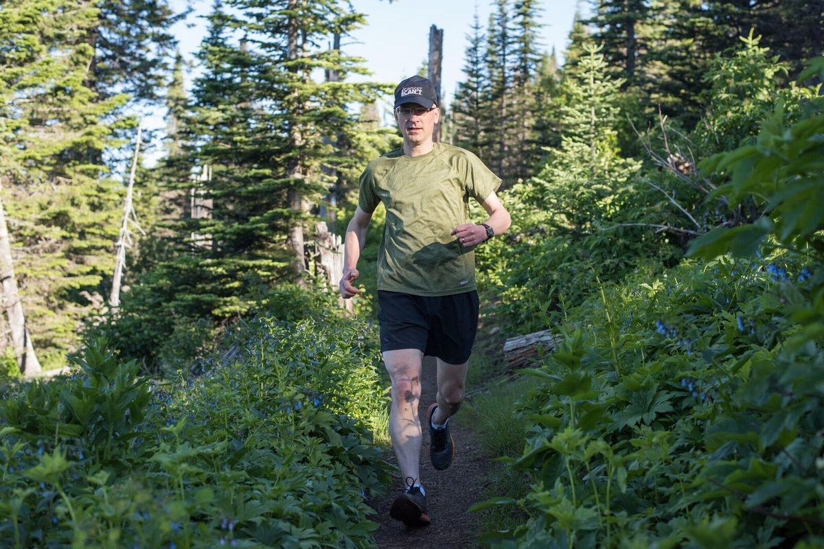 Brad Thiessen runs through the Dishman Hills Natural area. He has been diagnosed with brain cancer twice, most recently in 2015. Running helps him cope. (Craig Goodwin / Courtesy)