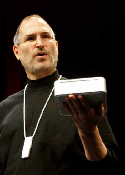 Apple CEO Steve Jobs unveils the Mini Mac and wears the iPod Shuffle around his neck. 
 (Associated Press / The Spokesman-Review)