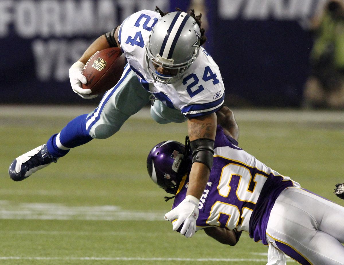 Minnesota’s Benny Sapp tackles Dallas’ Marion Barber during the first half. Barber ran eight times for 14 yards. (Associated Press)