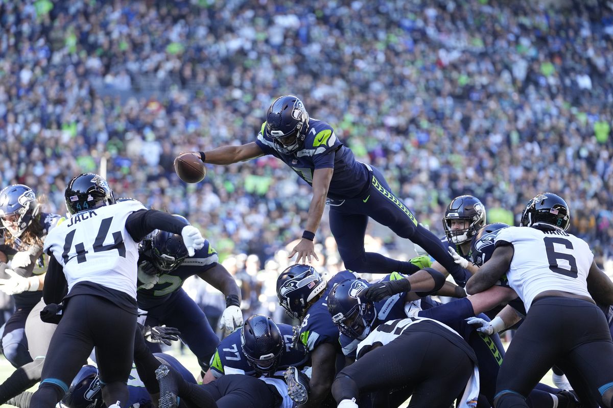 Seattle quarterback Geno Smith dives into the endzone against Jacksonville Sunday, Oct. 31, 2021, in Seattle. Smith completed 20 of 24 passes for 195 yards and two touchdowns.  (Associated Press)