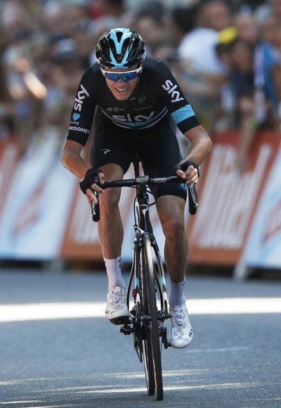 Chris Froome rides toward his win in the eighth stage of the Tour de France on Saturday. (Christophe Ena / Associated Press)