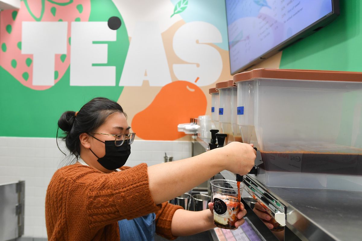 Mindy Bach prepares a Thai milk tea with boba at Tea’s Company, which recently opened in River Park Square in downtown Spokane.  (Tyler Tjomsland/The Spokesman-Review)