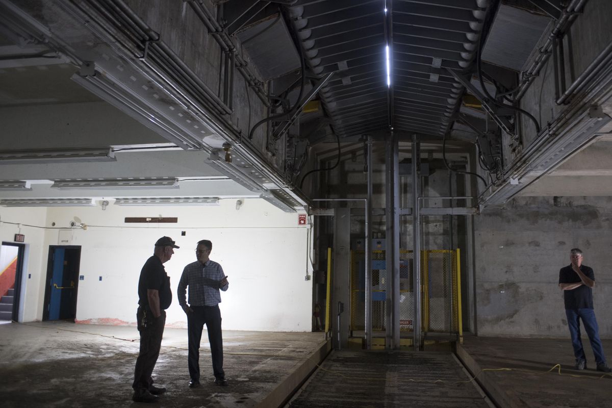 Gary Albrecht, Sean Dotson and Rich Brown of the Cheney School District tours the underground bunker where Nike missiles were once stored and lifted through the roof doors, Thursday, May 11, 2017. The district uses a former missile base in the rural countryside as its headquarters but the missile bunkers arent used for anything at present. (Jesse Tinsley / The Spokesman-Review)