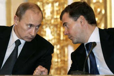 
Russian President Vladimir Putin, left, and First Deputy Prime Minister Dmitry Medvedev, his likely successor, talk at a meeting of the State Council in the Kremlin in Moscow on Wednesday. Associated Press
 (Associated Press / The Spokesman-Review)