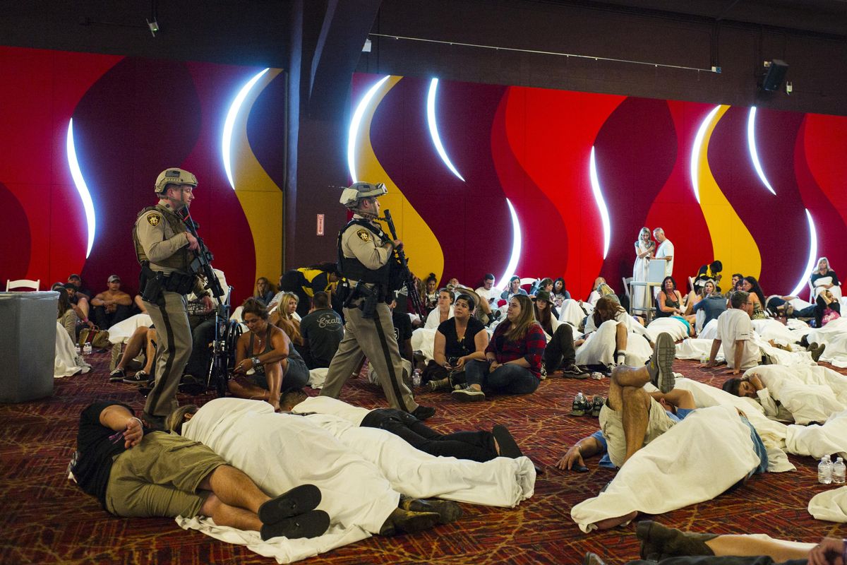Las Vegas police sweep through a convention center area during a lockdown Monday, Oct. 2, 2017, at the Tropicana Las Vegas following an active shooter situation on the Las Vegas Strip. Multiple victims were transported to hospitals after a deadly shooting late Sunday at a music festival on the Las Vegas Strip. (Chase Stevens / AP)