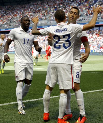Fabian Johnson (23) celebrates goal with Clint Dempsey, right, and Jozy Altidore. (Associated Press)