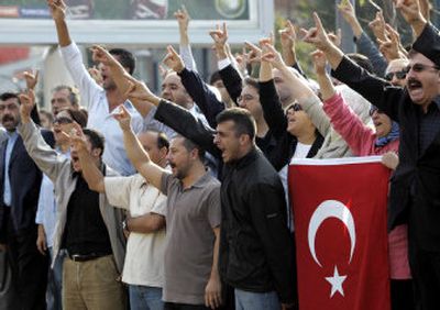 
Turkish nationalists chant slogans during a protest Saturday outside Bilgi University in Istanbul, Turkey, where the Armenian Conference is taking place. The twice-canceled conference on the massacre of Armenians in the late Ottoman Empire represents a test of Turkey's willingness to allow an open discussion of its painful past. 
 (Associated Press / The Spokesman-Review)