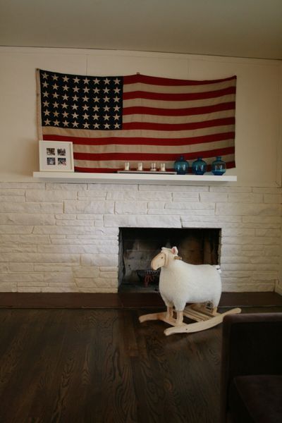 Can't afford original art but have a big space to fill? Hang something not normally used in homes, such as an old classroom map or a vintage flag. (Megan Cooley / The Spokesman-Review)