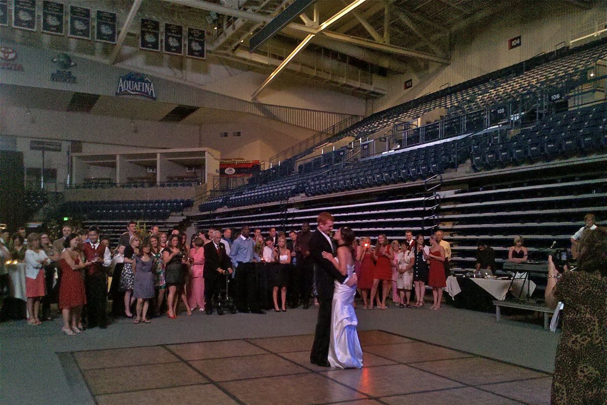 Lauren Zuckerman and David Pendergraft exchange vows at McCarthey Auditorium, a location usually known for sporting events or larger community gatherings.
(Cheryl-Anne Millsap / Kiss The Bride NW Correspondent)