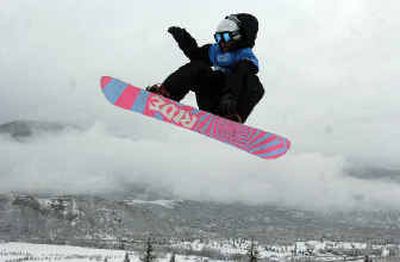 
Jimi Tomer catches air while on a practice run for the men's snowboard slopestyle at the X Games in Aspen, Colo.
 (Associated Press / The Spokesman-Review)