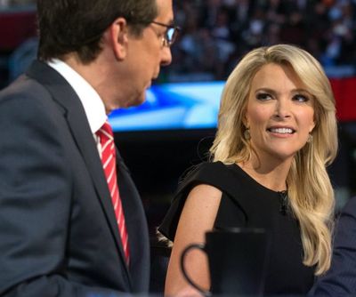 In this Thursday, Aug. 6, Fox News moderator Megyn Kelly, right, listens as Chris Wallace, begins introductions during the first Republican presidential debate at the Quicken Loans Arena, in Cleveland. Angry over what he considered unfair treatment at the debate, republican presidential candidate Donald Trump told CNN on Friday night that Kelly had 