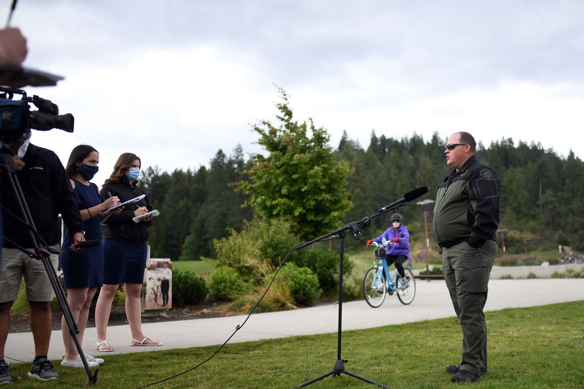 Lt. Ryan Higgins of the Kootenai County Sheriff’s Office holds a news conference Tuesday in Coeur d’Alene with the latest details of the midair crash that happened over Lake Coeur d’Alene on Sunday.  (Kathy Plonka/The Spokesman-Review)